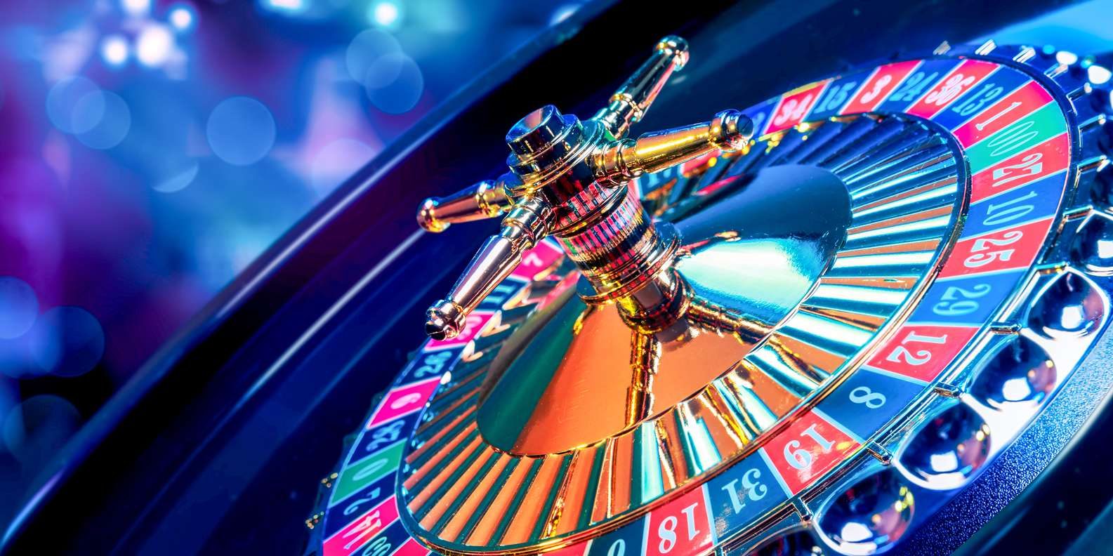 Close-up of a roulette wheel with the ball in a red pocket